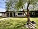 Charming single-story home with stone accents, a covered porch, and mature tree at 895 W Tyson St, Chandler, AZ 85225