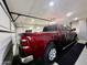 Spacious garage featuring ample storage, a red truck, and a well-lit interior at 895 W Tyson St, Chandler, AZ 85225