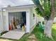 A detached garage used for storage with open door and nice landscaping at 895 W Tyson St, Chandler, AZ 85225