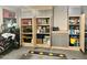 Organized garage storage solutions with open cabinets, showcasing ample space for tools and household items at 895 W Tyson St, Chandler, AZ 85225