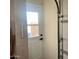 Picture of the garage, complete with door, window, and wall-mounted lighting at 895 W Tyson St, Chandler, AZ 85225