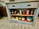 Kitchen island with open storage shelving, perfect for displaying dishware and kitchen essentials at 895 W Tyson St, Chandler, AZ 85225