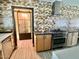 Modern kitchen featuring a stainless steel stove, stylish range hood, and unique patterned tile backsplash at 895 W Tyson St, Chandler, AZ 85225