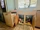 Under-sink storage solutions with pull-out trash can and compartments for cleaning supplies at 895 W Tyson St, Chandler, AZ 85225