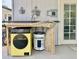 Image of the laundry area, with a water heater and washer for ultimate convenience at 895 W Tyson St, Chandler, AZ 85225