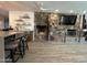 Living area with stone fireplace, hardwood floors and bar seating at 895 W Tyson St, Chandler, AZ 85225