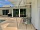 Covered patio featuring outdoor seating, sliding glass doors, and access to the pool at 895 W Tyson St, Chandler, AZ 85225