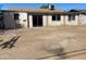View of the home's backyard with sliding glass doors at 5559 N 62Nd Ave, Glendale, AZ 85301