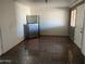 Bright dining area with stainless steel refrigerator and tiled floor at 5559 N 62Nd Ave, Glendale, AZ 85301