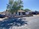 Street view of a cozy single-story home with a brick fence and a large tree at 5559 N 62Nd Ave, Glendale, AZ 85301