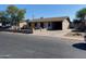 Simple single-story house with a carport and minimal landscaping at 5559 N 62Nd Ave, Glendale, AZ 85301