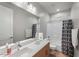 Clean bathroom with double vanity, shower/tub combo and updated fixtures at 42459 W Paseo Dr, Maricopa, AZ 85138