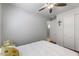 Cozy bedroom with ceiling fan and ample closet space at 42459 W Paseo Dr, Maricopa, AZ 85138