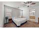 Spacious bedroom with ceiling fan and ensuite bathroom at 42459 W Paseo Dr, Maricopa, AZ 85138