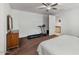 Bright bedroom with a treadmill and built in closet at 42459 W Paseo Dr, Maricopa, AZ 85138