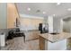 Modern kitchen with granite countertops and stainless steel appliances at 42459 W Paseo Dr, Maricopa, AZ 85138