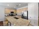 Modern kitchen with granite countertops and stainless steel appliances at 42459 W Paseo Dr, Maricopa, AZ 85138