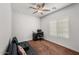 Home office featuring a desk, chair, and comfortable sofa at 42459 W Paseo Dr, Maricopa, AZ 85138