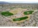 Scenic golf course with lush green fairways and desert landscaping in a vibrant community setting at 15175 S 185Th Ave, Goodyear, AZ 85338