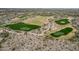 Picturesque aerial view of a well-maintained golf course surrounded by desert landscape and residential homes at 15175 S 185Th Ave, Goodyear, AZ 85338