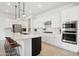 Well-appointed kitchen featuring a large island, stainless steel appliances, and stylish pendant lighting at 15175 S 185Th Ave, Goodyear, AZ 85338