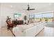 Bright living space with a sectional, entertainment center, and views of the backyard pool at 15175 S 185Th Ave, Goodyear, AZ 85338