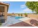 Beautiful pool and patio with desert landscaping, creating an inviting backyard space for relaxation at 15175 S 185Th Ave, Goodyear, AZ 85338