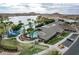 Community pool with waterslides, sun loungers, and a clubhouse, set against a backdrop of mountains and a lake at 15175 S 185Th Ave, Goodyear, AZ 85338