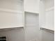 Organized walk-in closet with built-in shelving and hanging rods at 15175 S 185Th Ave, Goodyear, AZ 85338