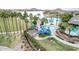 Fun community waterpark with slides, a lighthouse, and lush landscaping offering a Gathering-friendly amenity at 15175 S 185Th Ave, Goodyear, AZ 85338