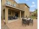 Inviting covered patio, outdoor seating, and a lush backyard, ideal for entertaining at 7351 W Palo Brea Ln, Peoria, AZ 85383