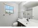 Clean bathroom with single sink vanity, shower, and toilet at 7351 W Palo Brea Ln, Peoria, AZ 85383