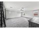Spacious bedroom with ceiling fan and carpet flooring at 7351 W Palo Brea Ln, Peoria, AZ 85383