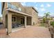 Two story home with covered patio and brick-paved backyard at 7351 W Palo Brea Ln, Peoria, AZ 85383