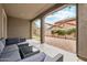 Spacious backyard patio with seating area and view of the community at 7351 W Palo Brea Ln, Peoria, AZ 85383
