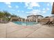 Community pool with a spa and lounge chairs at 7351 W Palo Brea Ln, Peoria, AZ 85383