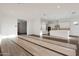 Modern kitchen with white cabinetry and an island at 13567 W Steed Ridge Rd, Peoria, AZ 85383