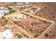 Aerial view showing a single-story home with surrounding desert landscape at 323 W Quartz Rock Rd, Phoenix, AZ 85085