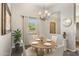 Dining area featuring a round wooden table and neutral-toned decor at 323 W Quartz Rock Rd, Phoenix, AZ 85085