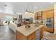 Kitchen with an island, wooden cabinetry, and stainless steel appliances at 323 W Quartz Rock Rd, Phoenix, AZ 85085