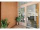 Inviting entryway with tiled flooring, wood door, and view into living room at 4924 W Boston St, Chandler, AZ 85226