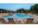 Relaxing resort-style pool with lounge chairs at 2425 W Bronco Butte Trl # 2017, Phoenix, AZ 85085