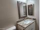 Modern bathroom vanity with granite countertop and mirror at 3915 N Juniper Dr, Eloy, AZ 85131