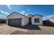 New construction home with a two-car garage and attractive landscaping at 3915 N Juniper Dr, Eloy, AZ 85131