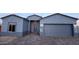 Modern home with a gray exterior and a two-car garage at 3915 N Juniper Dr, Eloy, AZ 85131