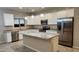 Modern kitchen with island, stainless steel appliances, and granite countertops at 3915 N Juniper Dr, Eloy, AZ 85131