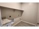 Laundry room with granite countertop and built-in shelving at 3915 N Juniper Dr, Eloy, AZ 85131