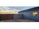 New home with a wooden gate and block wall at 3915 N Juniper Dr, Eloy, AZ 85131