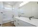 Modern bathroom with double vanity, large mirror, and tub at 18956 W Ocotillo Rd, Waddell, AZ 85355