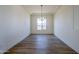 Simple dining room with chandelier and large windows at 18956 W Ocotillo Rd, Waddell, AZ 85355